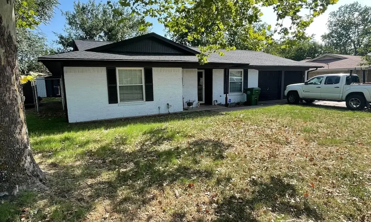 Professional roofing crew working on a residential roof in Lower Oxford